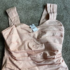 Express light pink tank and skirt set never worn tags still in tack size small.